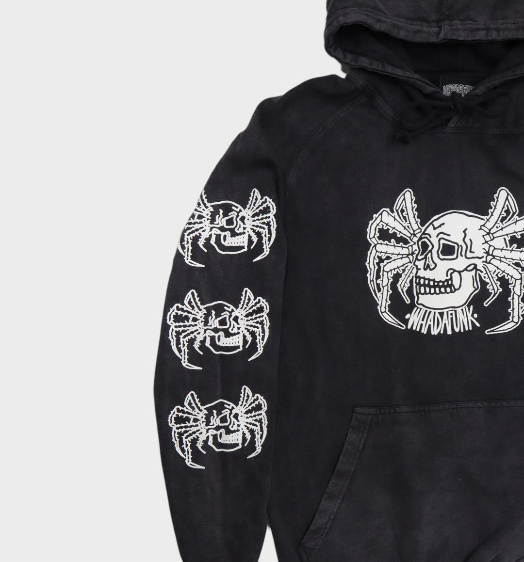 Close-up of hand-drawn spider and skull design on hoodie sleeves view