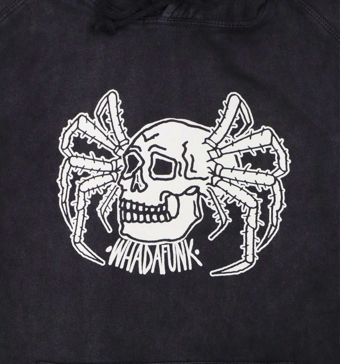 Close-up of hand-drawn spider and skull design on hoodie front