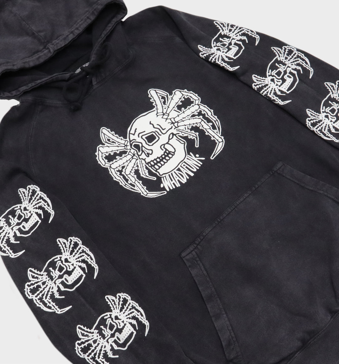 Close-up of hand-drawn spider and skull design on hoodie angle