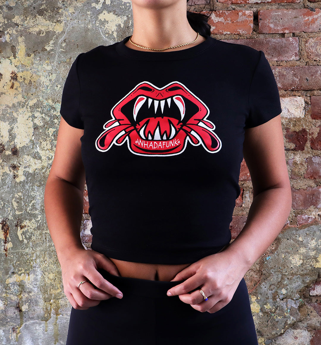 WHADAFUNK Vamp Mouth Crop Tee featuring a bold vampire lips design, perfect for edgy women's streetwear.