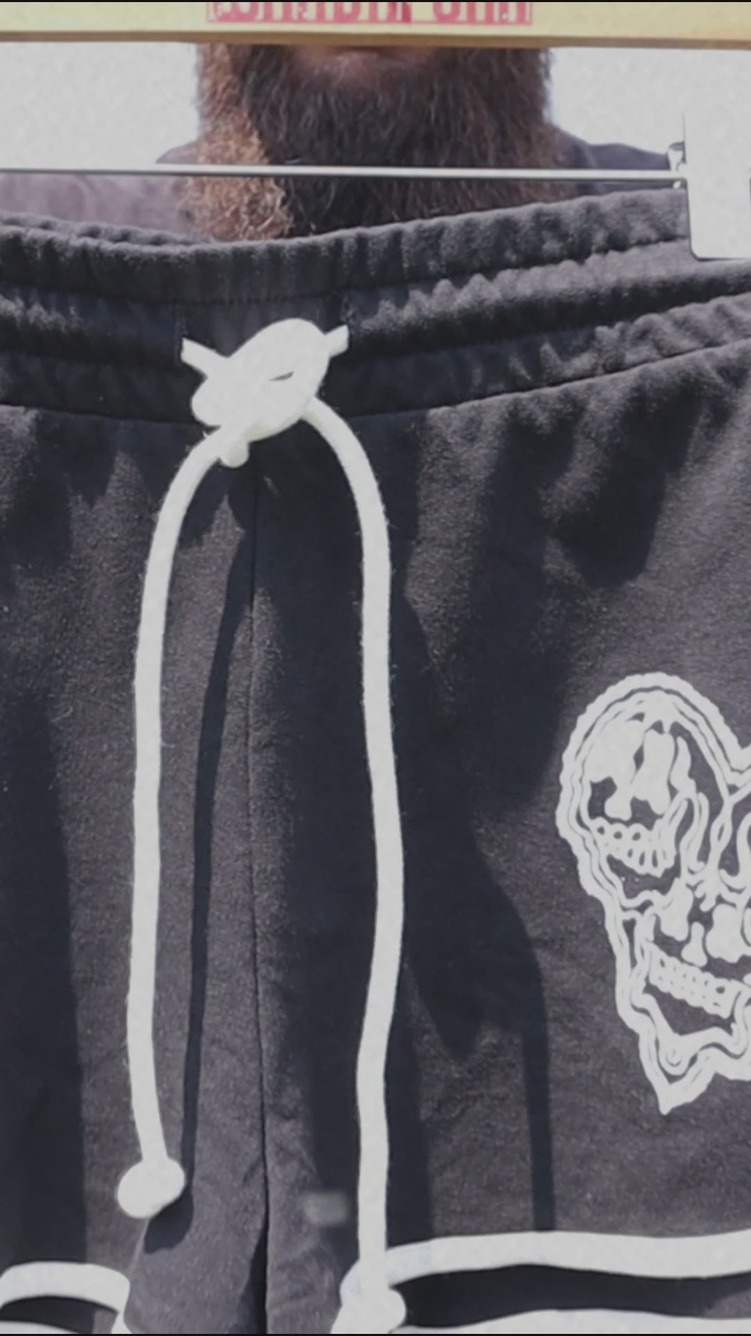 WHADAFUNK Skull Heart Striped Shorts with bold skull and heart graphic design and striped detailing for streetwear style.