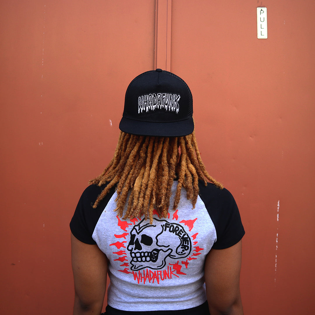 WHADAFUNK Drippy Trucker Hat featuring a bold dripping logo for streetwear lovers.