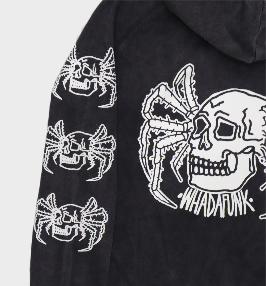 Back of hand-drawn spider and skull design on hoodie close up