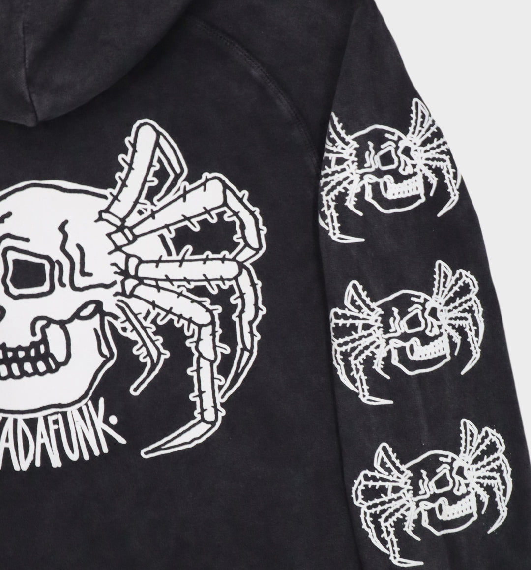 Back of hand-drawn spider and skull design on hoodie sleeve details