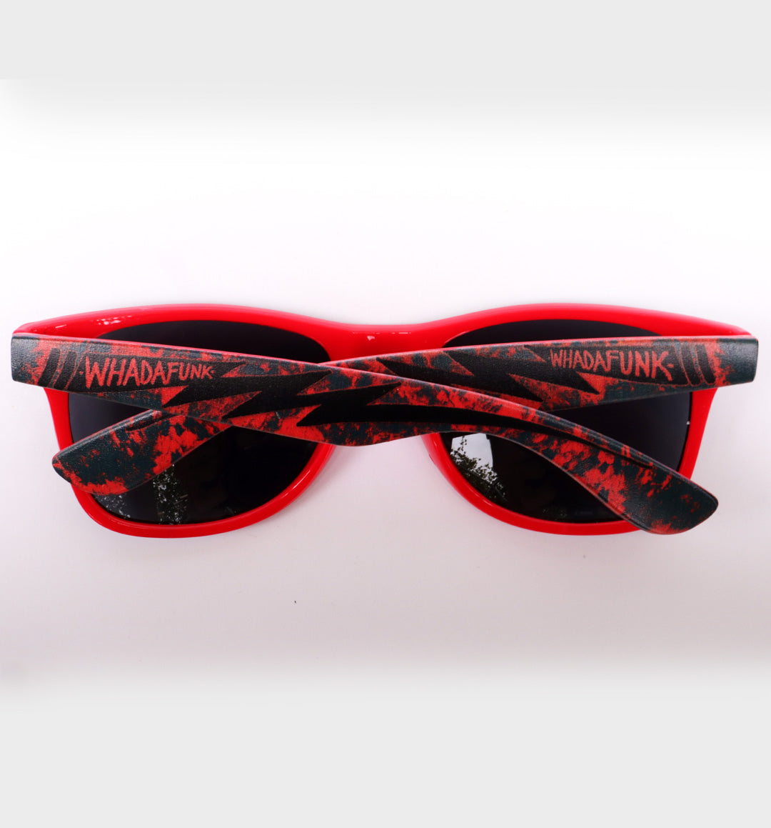WHADAFUNK Red Lightning Sunglasses with bold lightning bolt design and red frames for streetwear style.