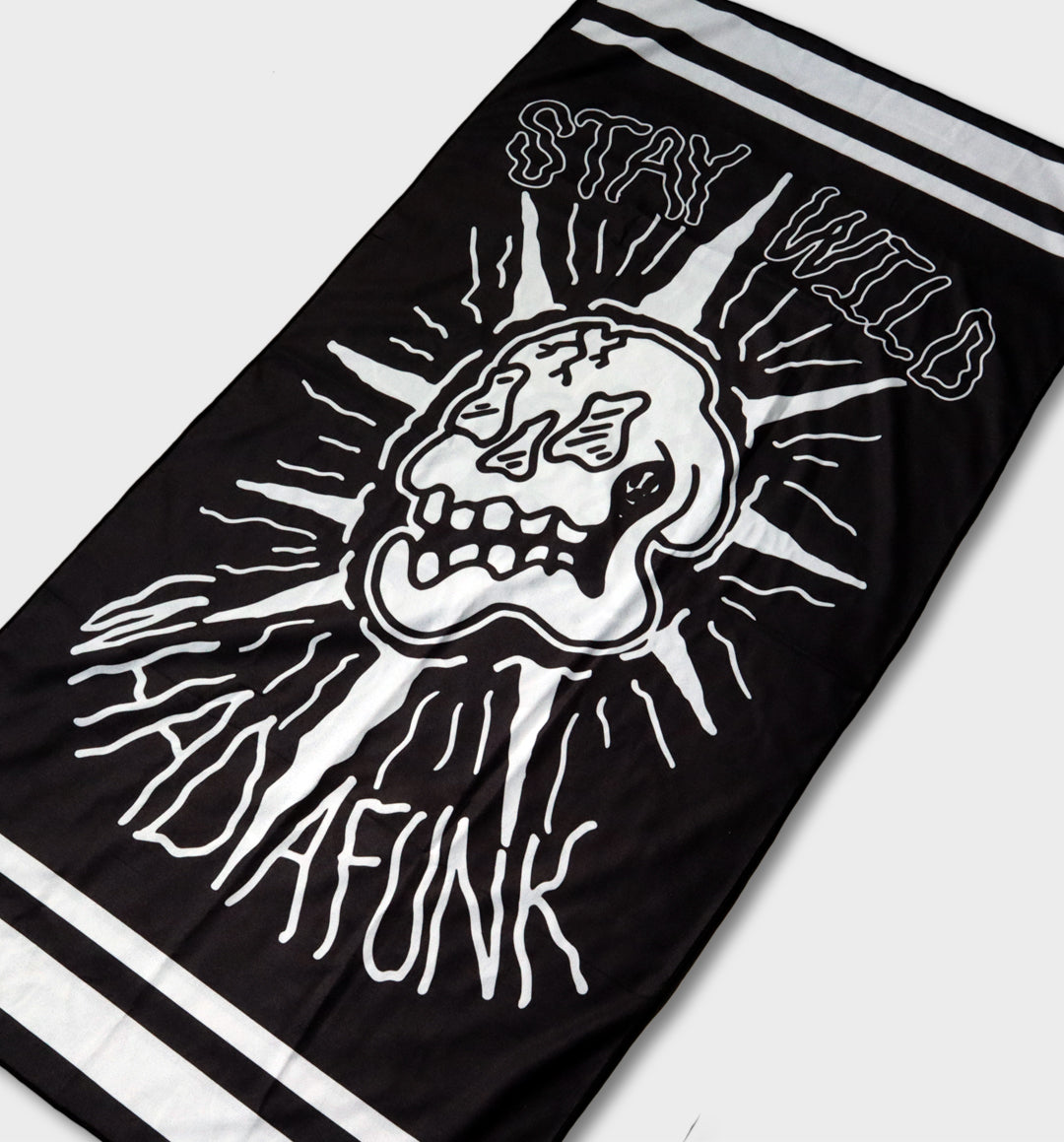 WHADAFUNK Stay Wild Beach Towel featuring bold and vibrant design perfect for the beach or pool.