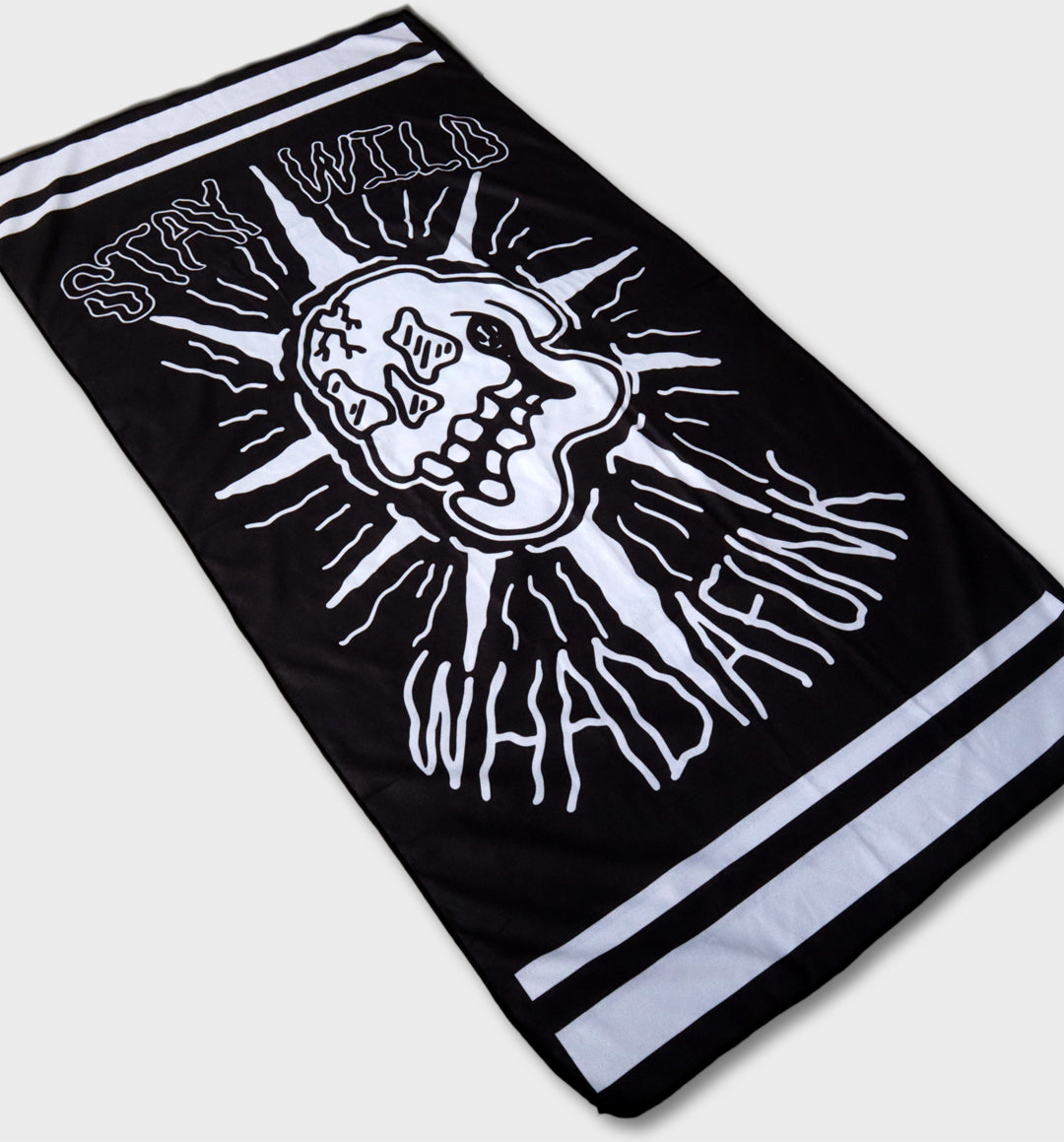 WHADAFUNK Stay Wild Beach Towel featuring bold and vibrant design perfect for the beach or pool.
