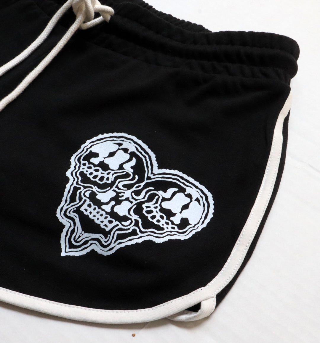 WHADAFUNK Skull Heart Striped Shorts with bold skull and heart graphic design and striped detailing for streetwear style.