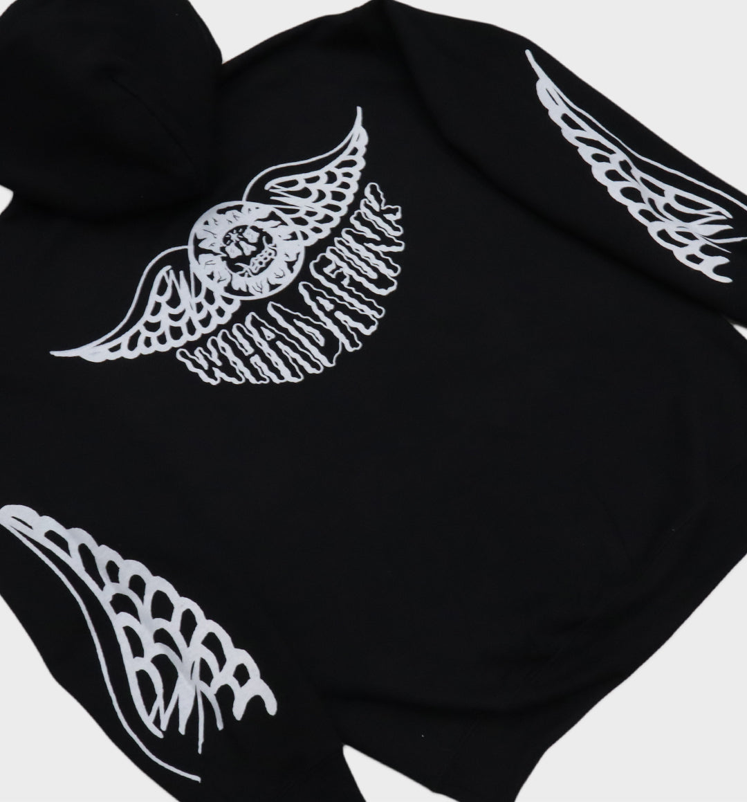 Back angle of hand-drawn winged skull and eye design on hoodie