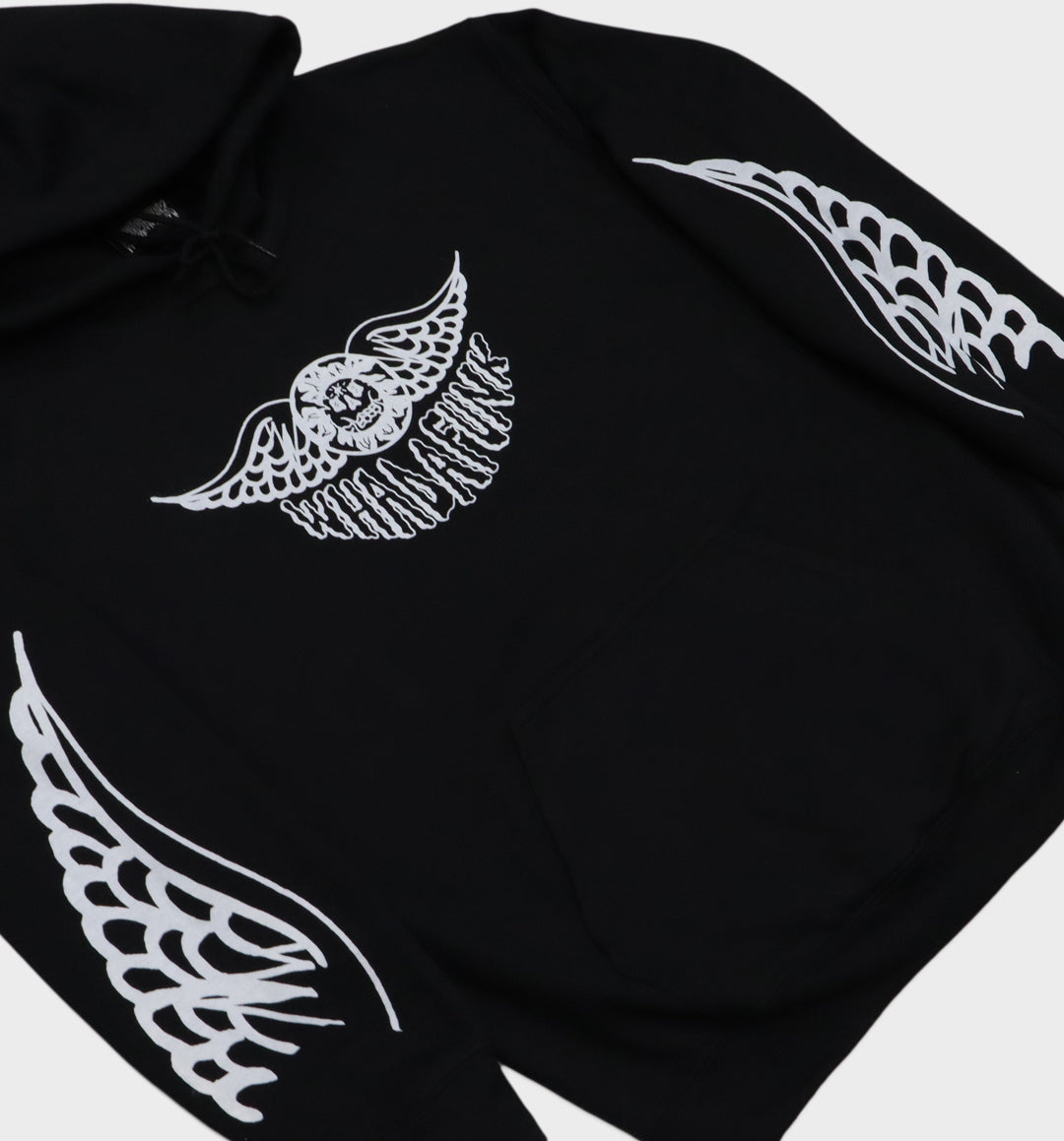 Angle details of hand-drawn winged skull and eye design on hoodie